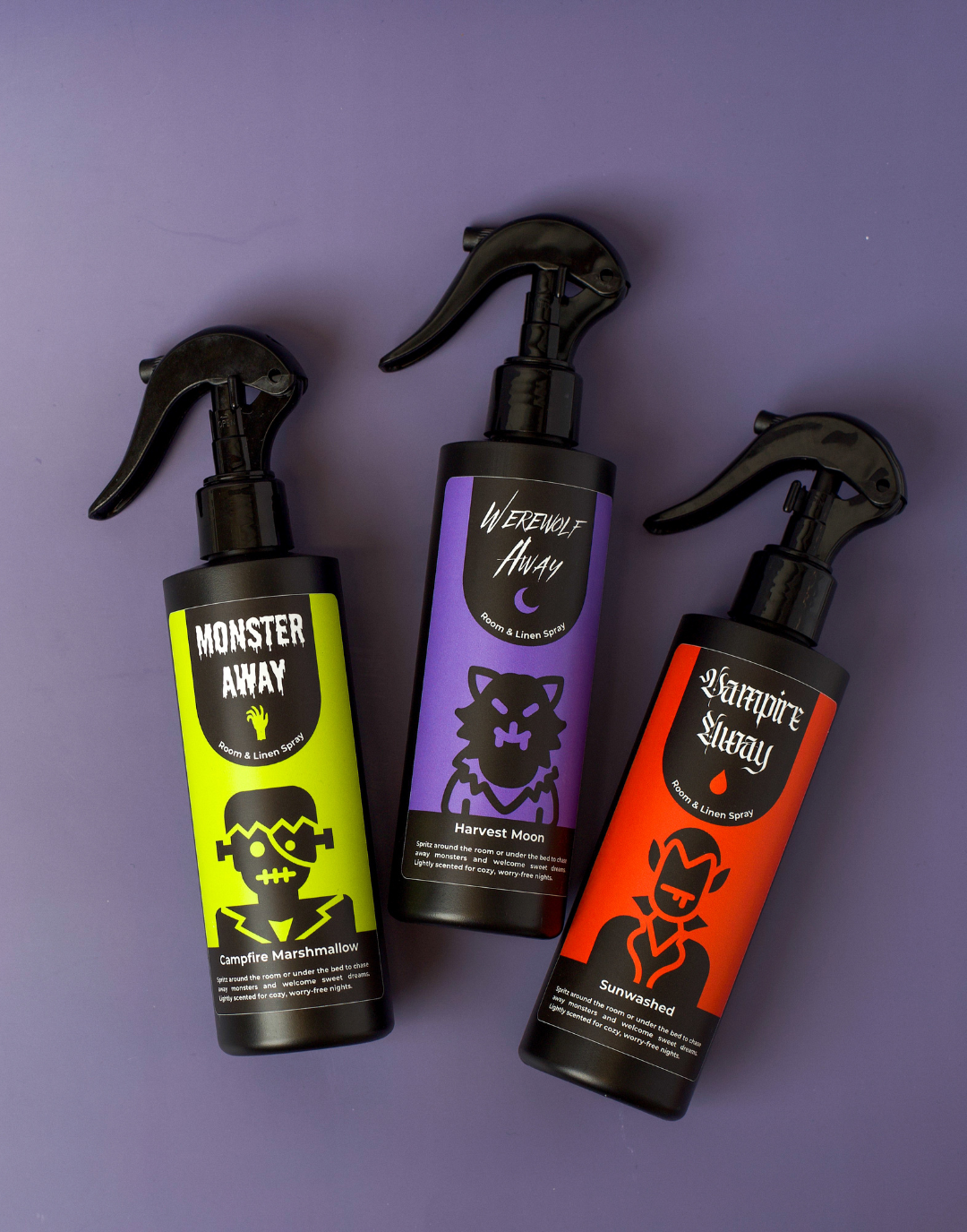 A trio of different monster sprays with labels.